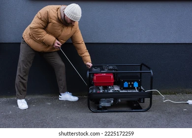 Man Starting Portable Generator Outdoors PNG