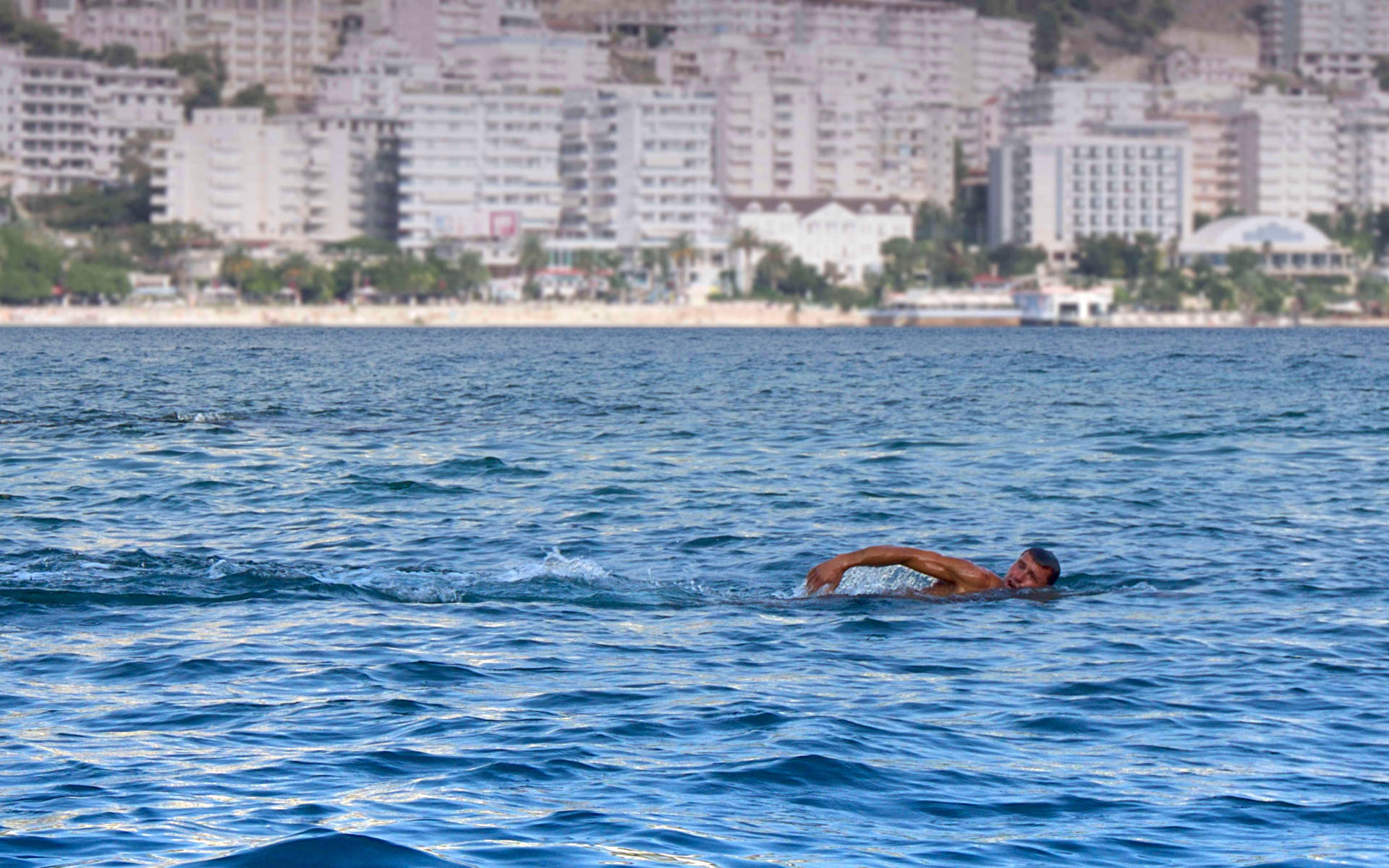Man Swimming In Ocean Wallpaper