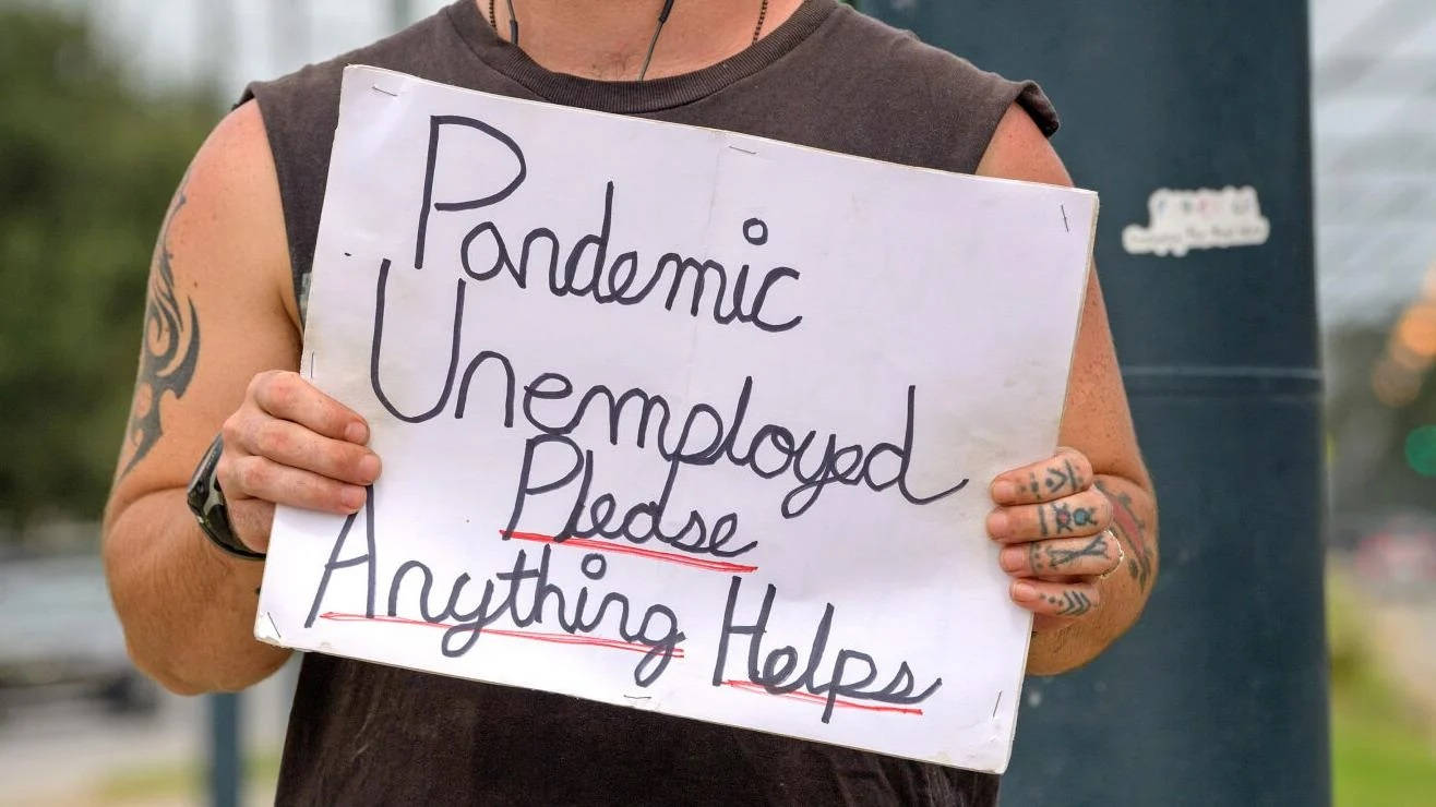 Man Unemployment Signboard During Pandemic Wallpaper
