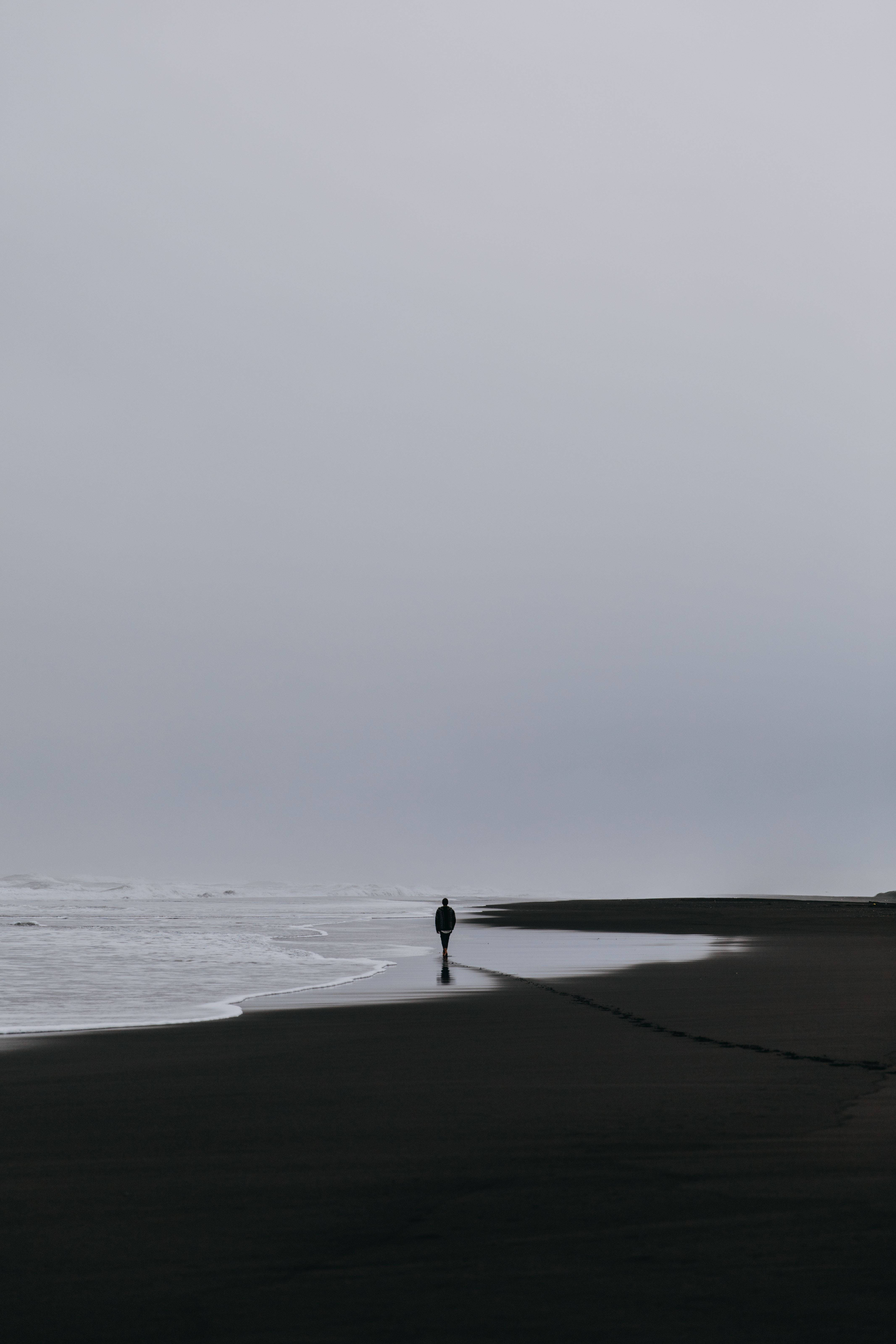 Man Walking At Beach Alone Phone Wallpaper