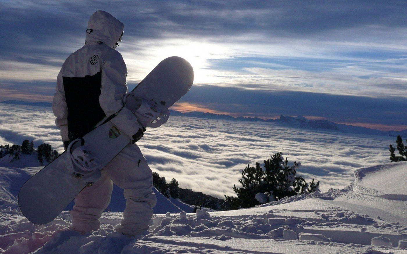Adventurous Solitude - Man with Snowboard Wallpaper