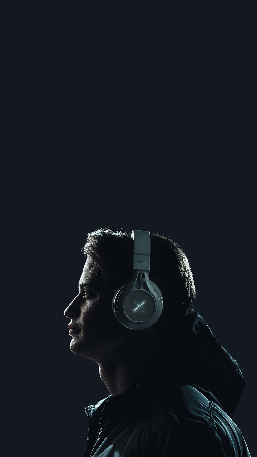 Man Wearing A Wireless Peripheral Headphones Wallpaper