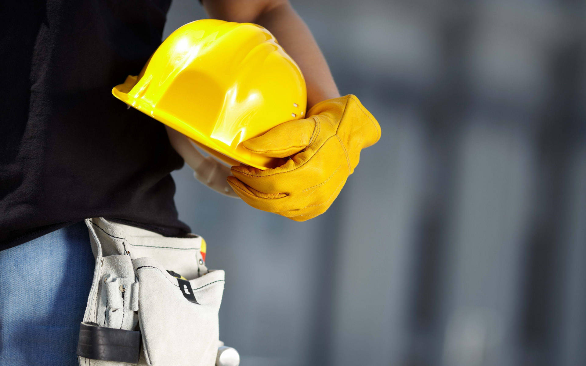 Man With A Glove Carrying Construction Hard Hat Wallpaper