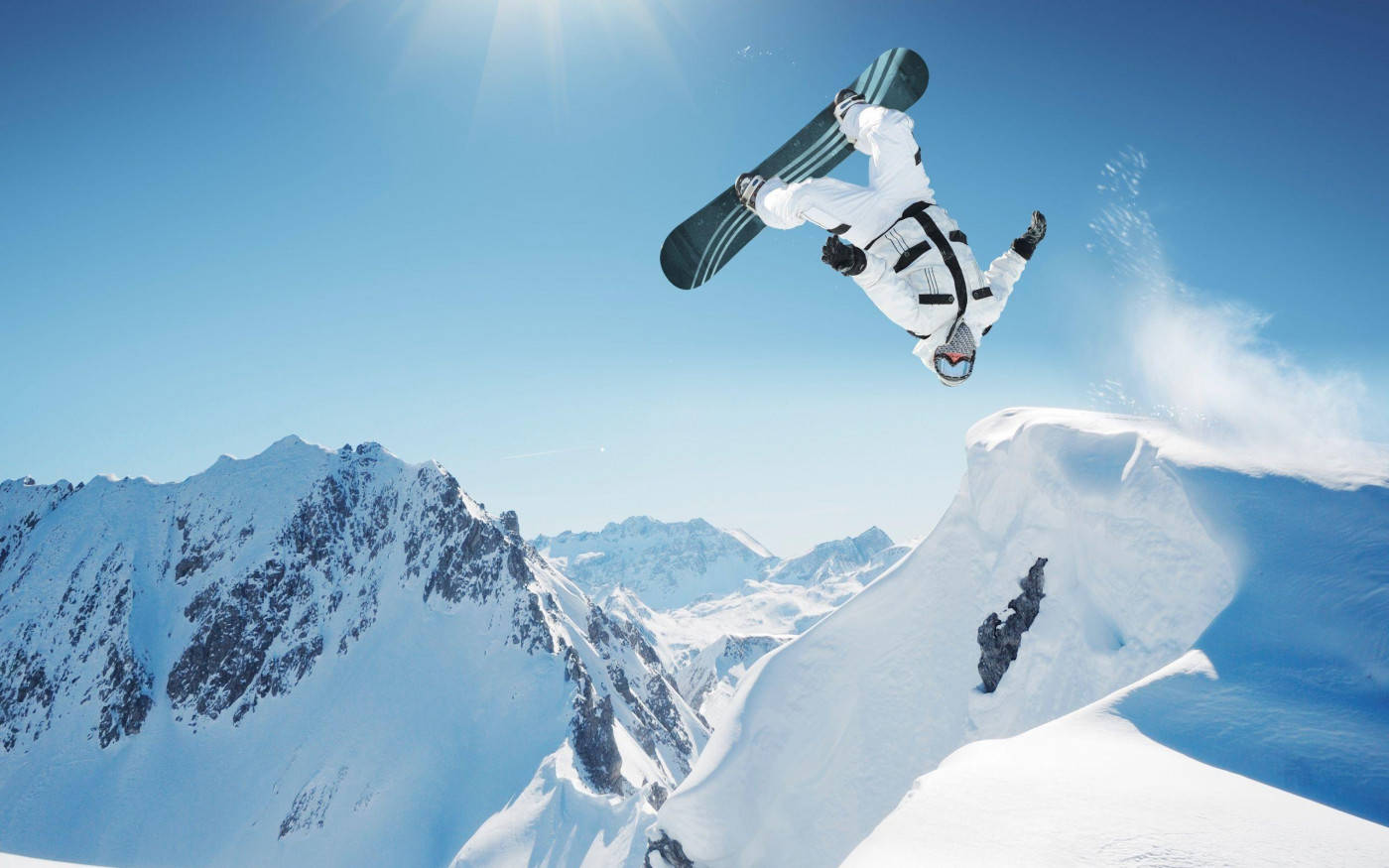 Man With A Snowboard Doing A Backflip Wallpaper