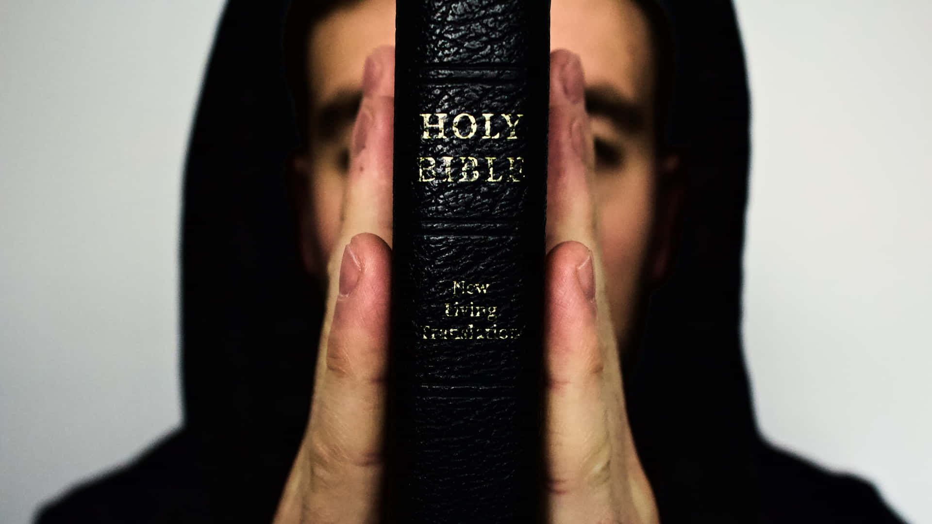 Man With Black Holy Bible Wallpaper