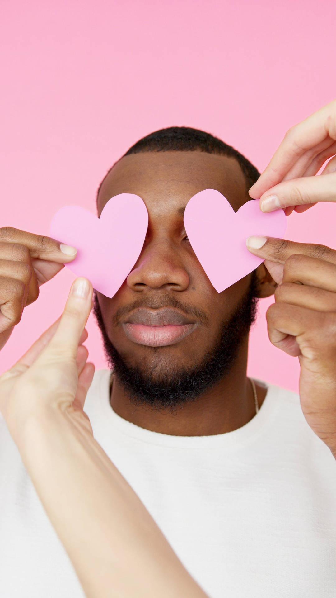 Man With Pastel Pink Heart Cutouts Wallpaper