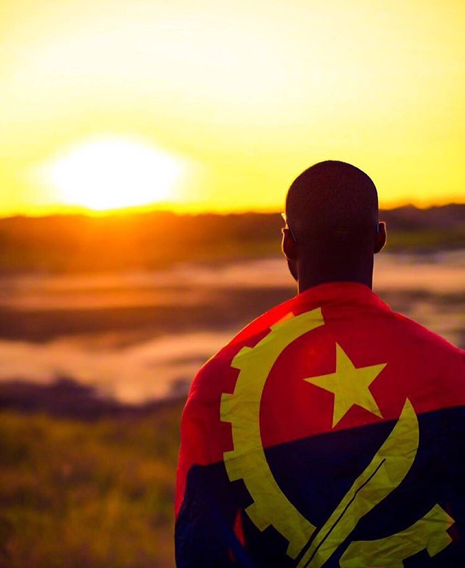 Man With The Flag Of Angola Wallpaper
