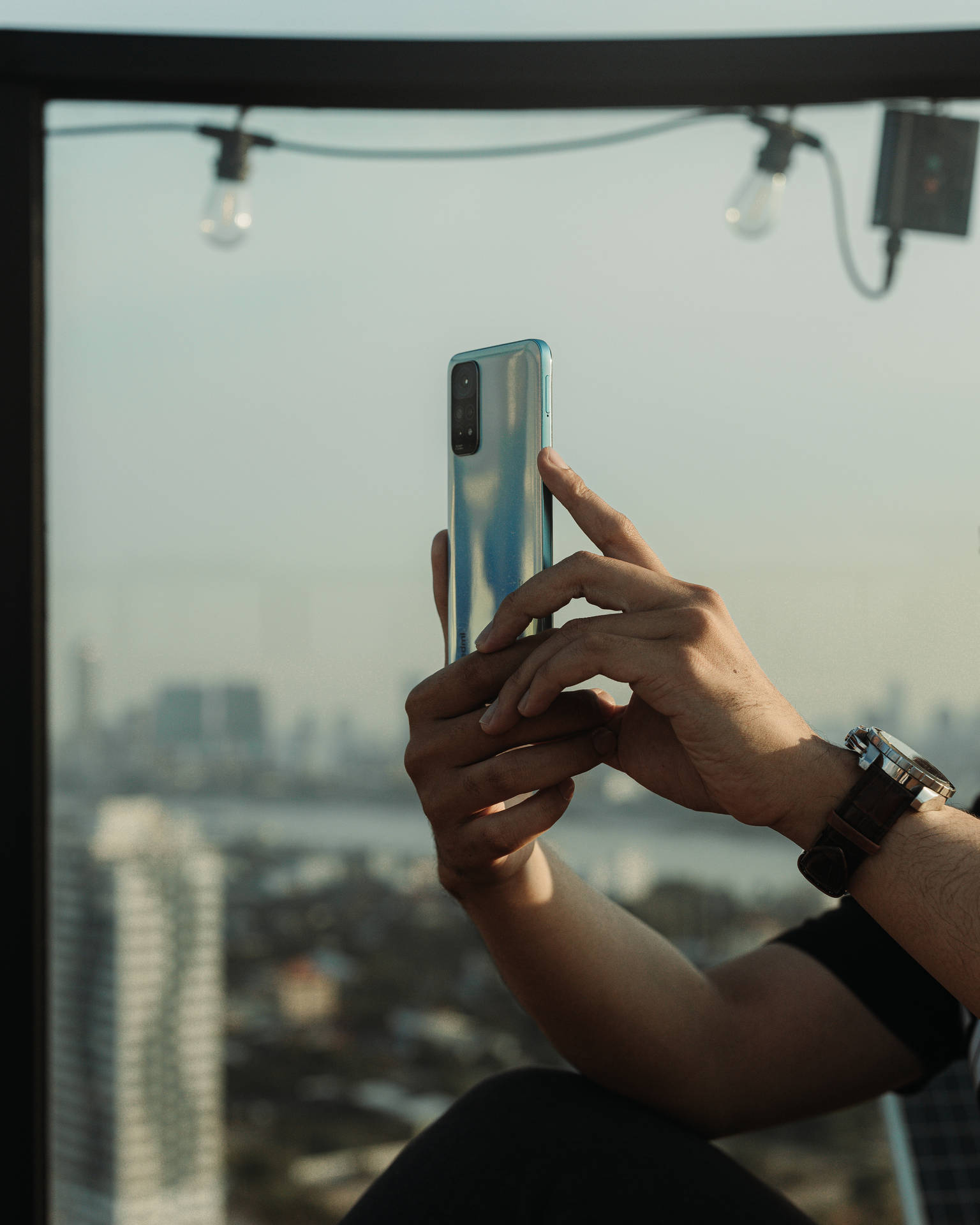 Download Man With Xiaomi Smartphone Wallpaper | Wallpapers.com