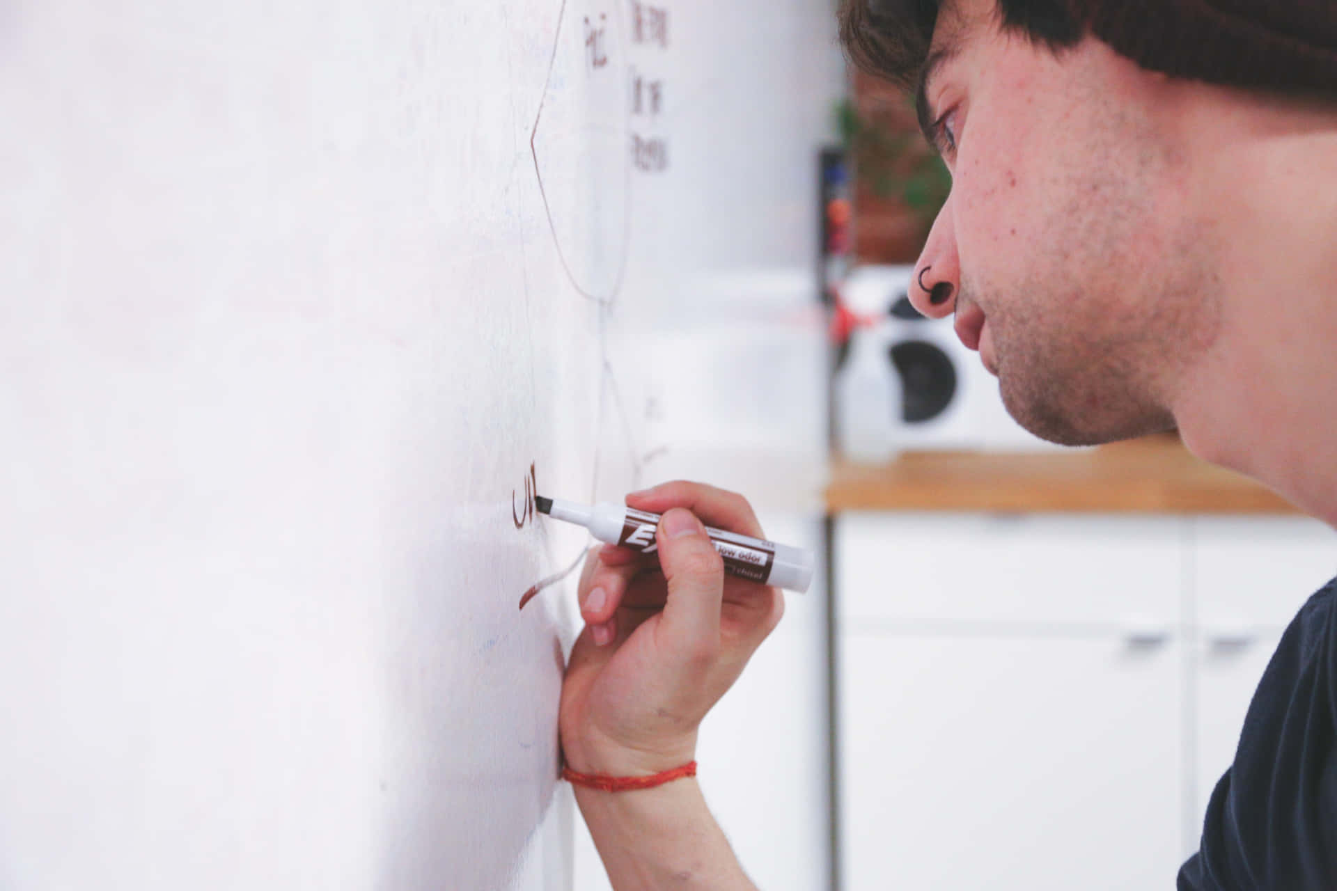 Man Writing On Whiteboard Using Permanent Marker Wallpaper