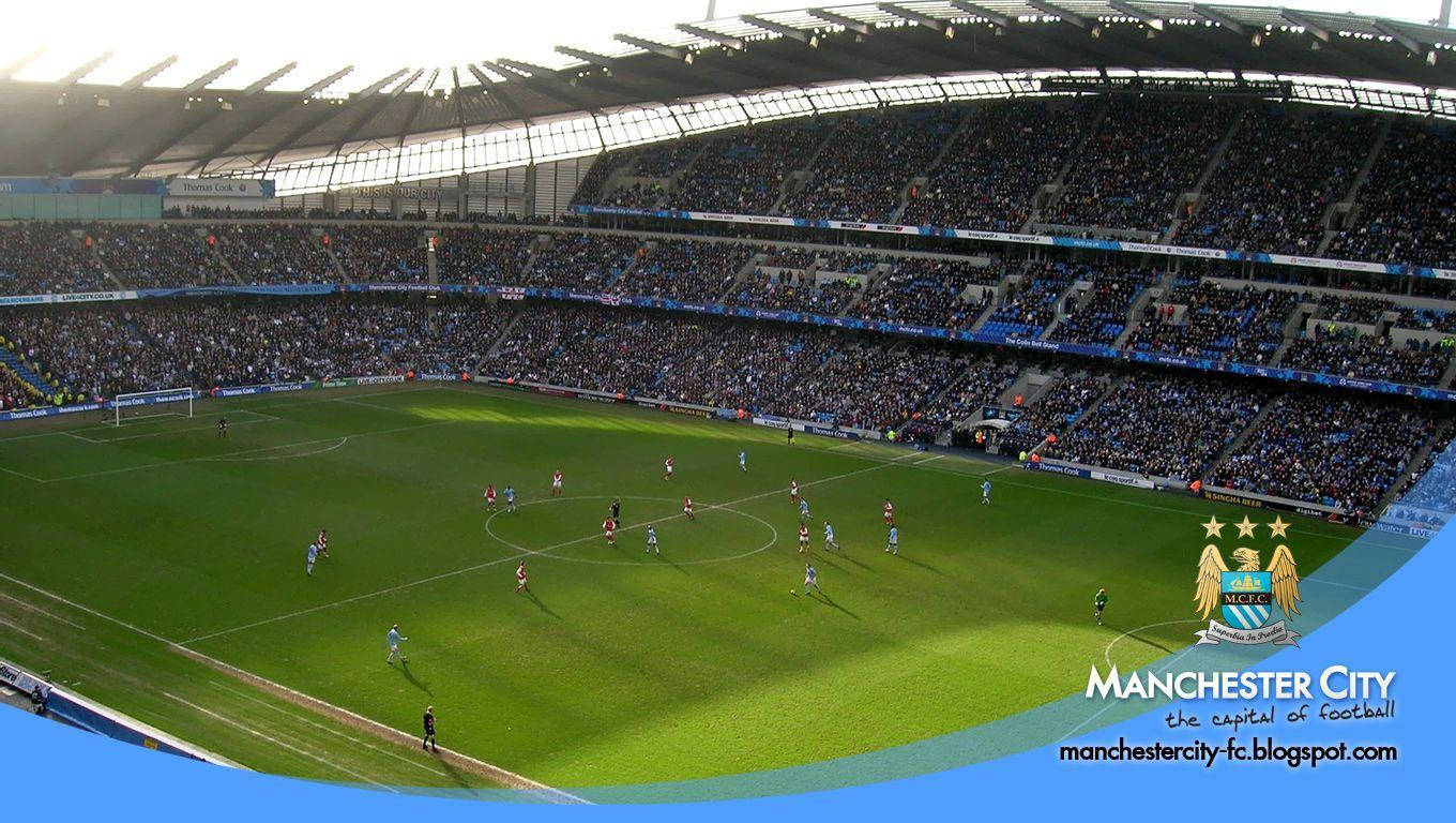 Manchester City Fc Logo Over Etihad Stadium Wallpaper