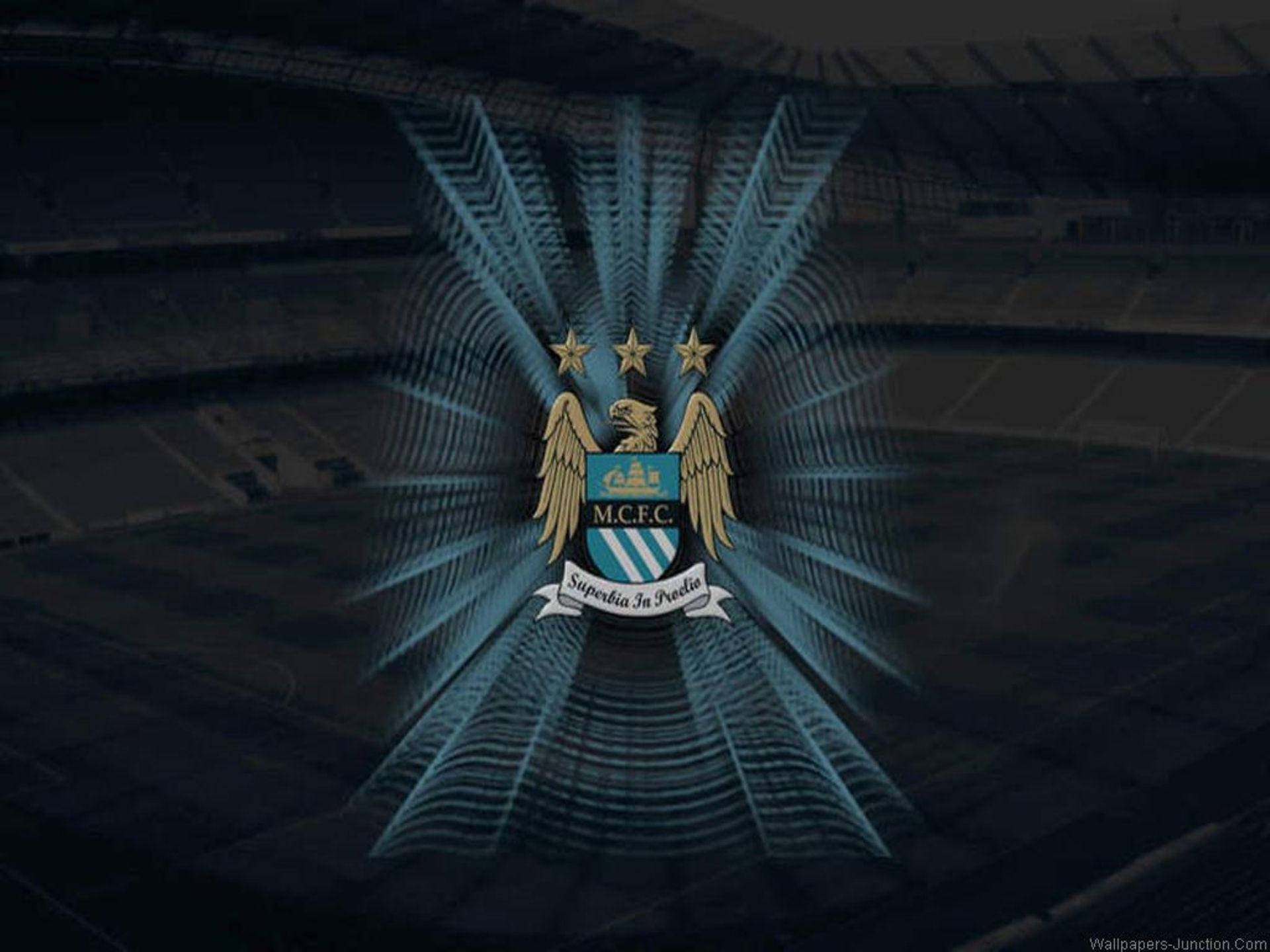 Manchester City Fc Logo Over Shaded Stadium Wallpaper