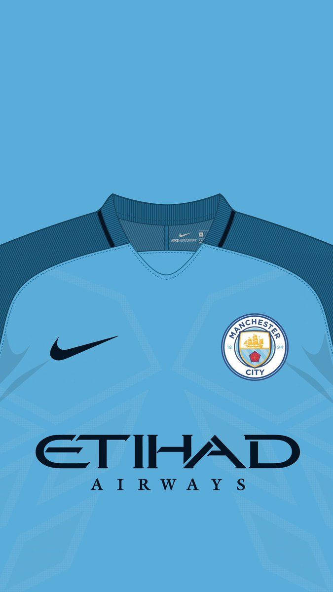 Manchester City Logo On Blue Jersey Background