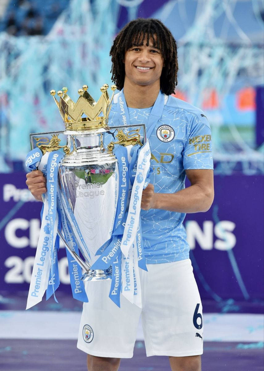 Manchester City Nathan Ake Holding Trophy Wallpaper