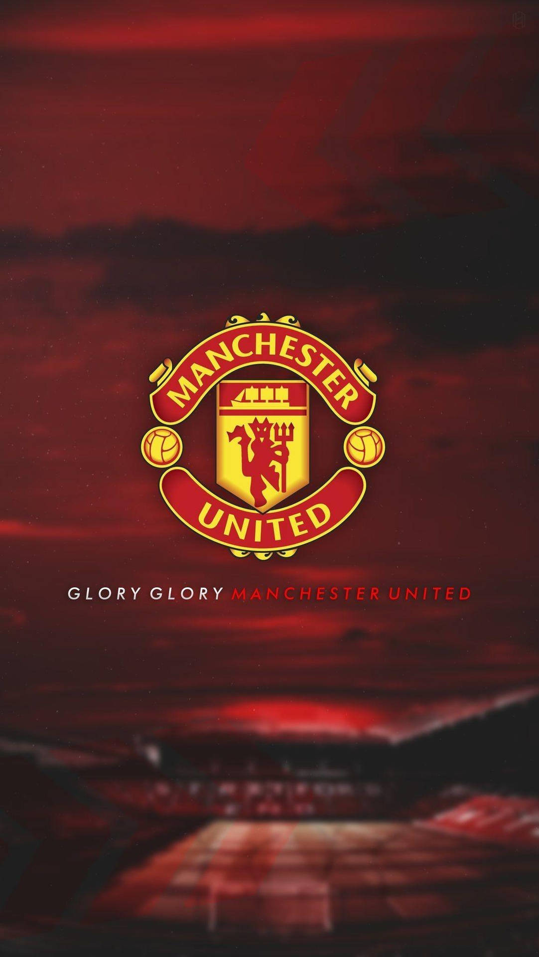 Manchester United Emblem With A Fiery Background Wallpaper