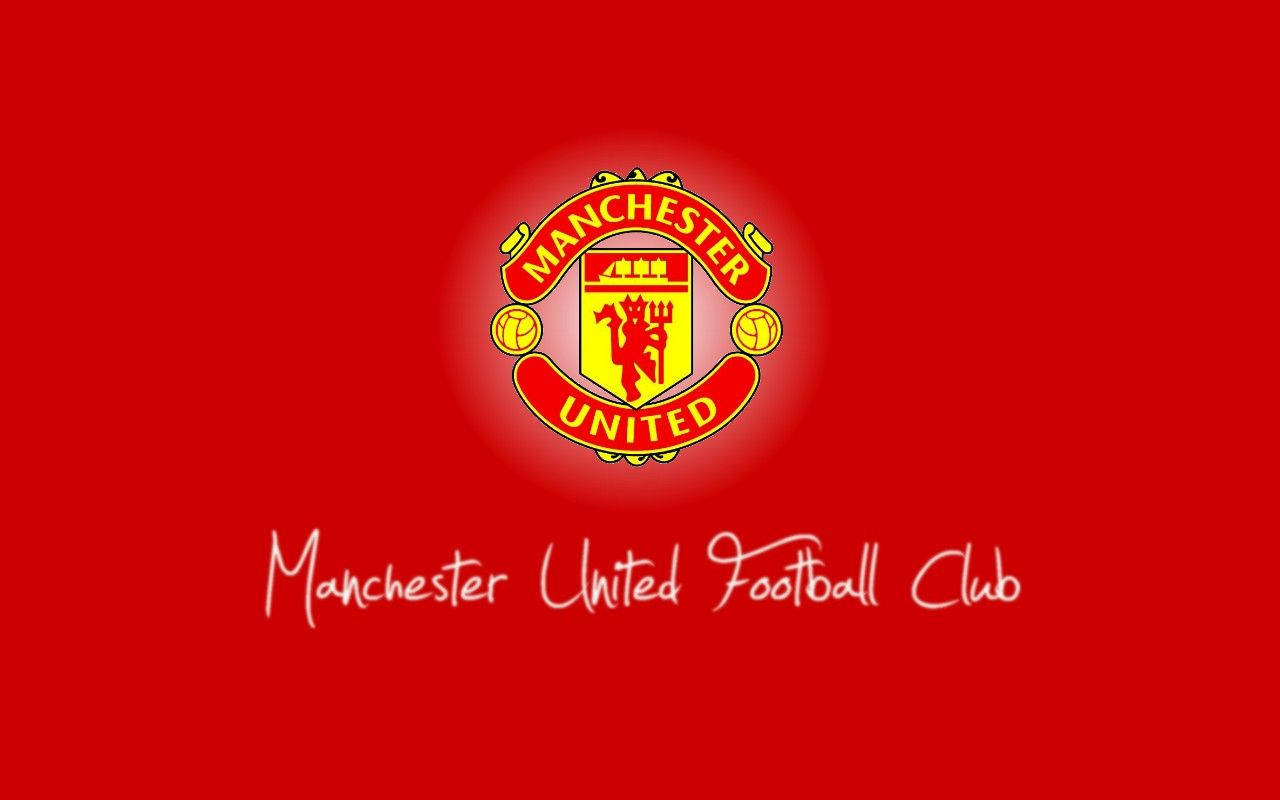 Manchester United Iconic Team Crest Passionately Illustrated On A Vibrant Red Background. Wallpaper