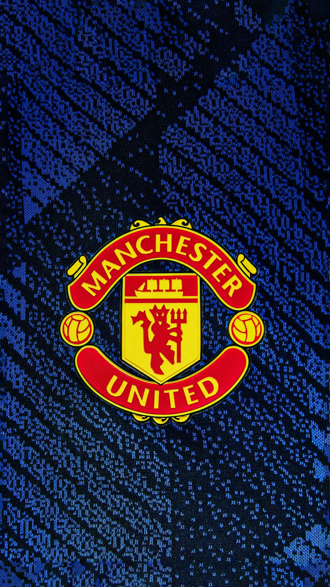 Manchester United Team Logo On Blue Wallpaper