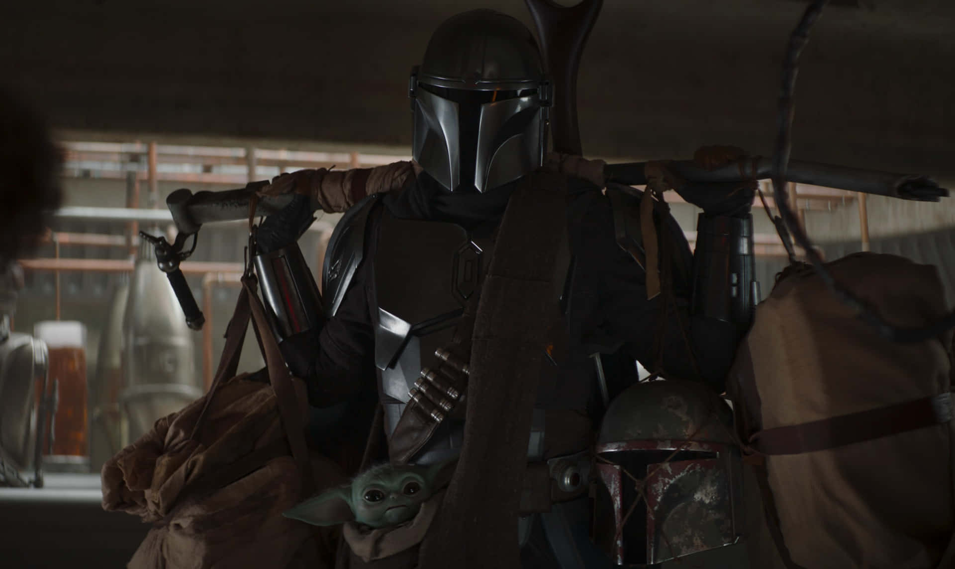 Defending his people, the Mandalorian stands ready for battle.
