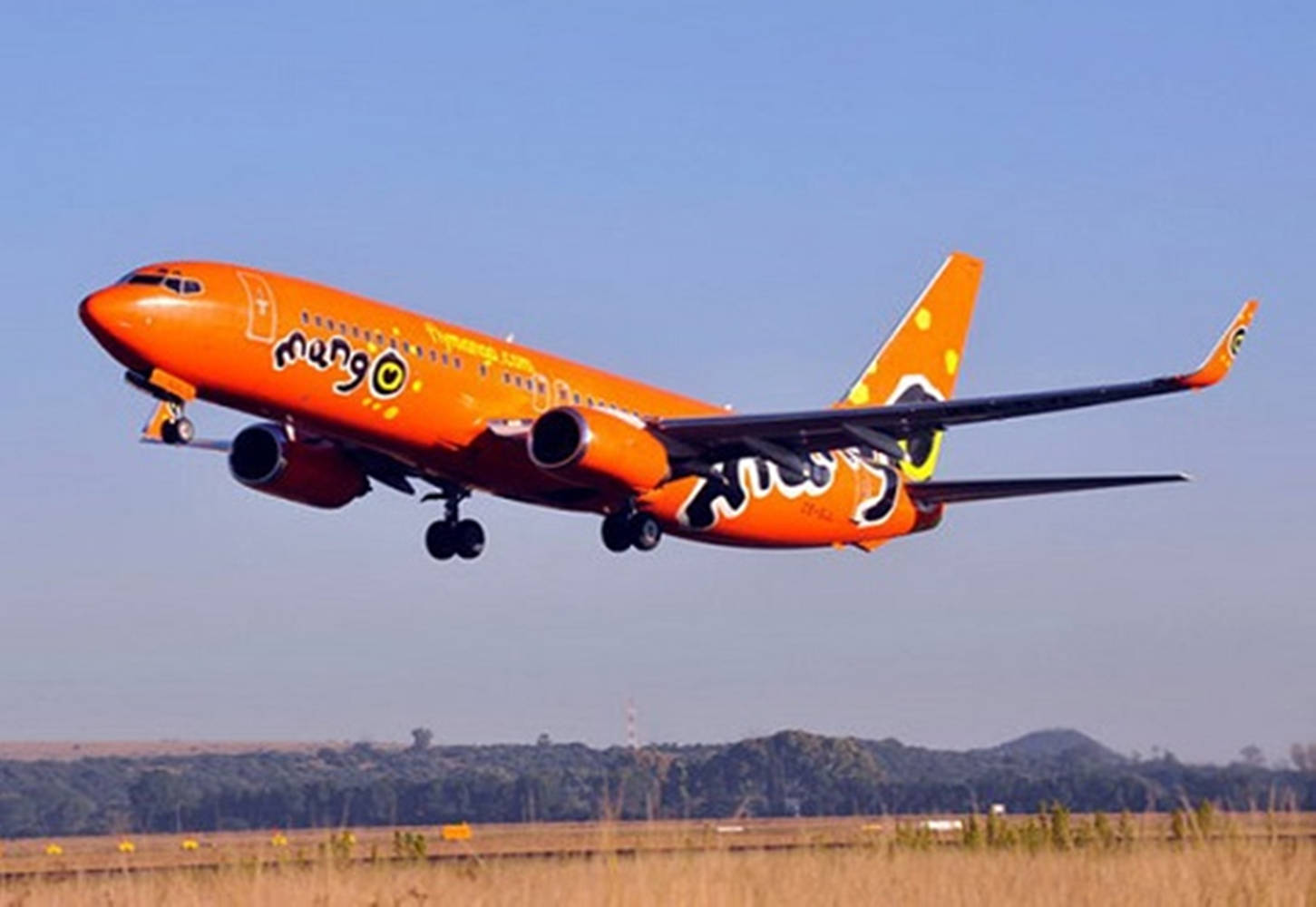 Mango Airlines Airplane In Flight Wallpaper