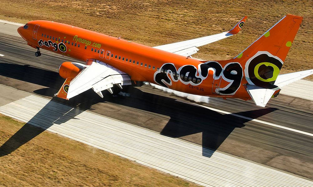 Mangoairlines Startbana (for A Computer/mobile Wallpaper Of An Airplane Taking Off From A Runway With The Mango Airlines Logo) Wallpaper
