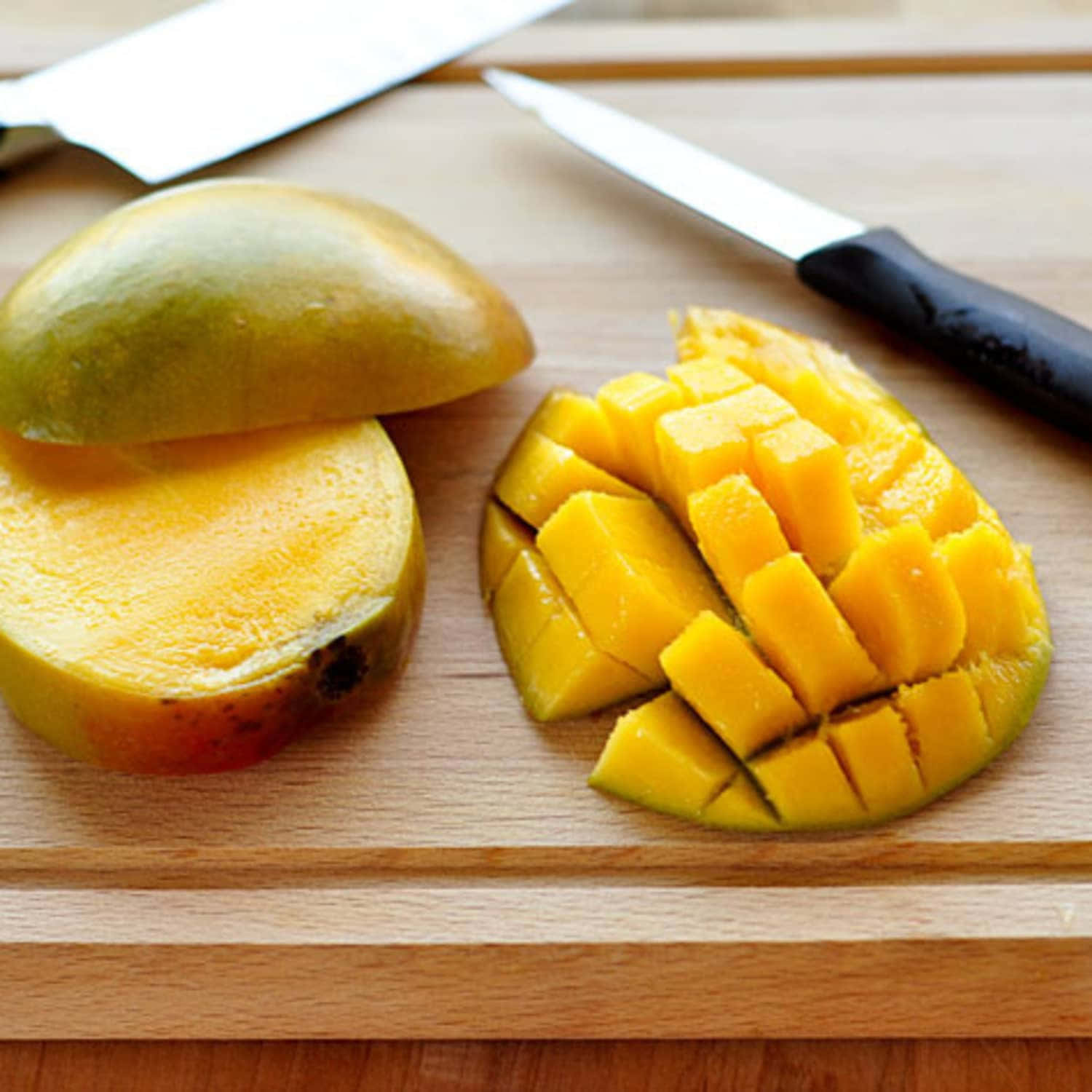 Enjoying the sweet taste of a ripe mango!