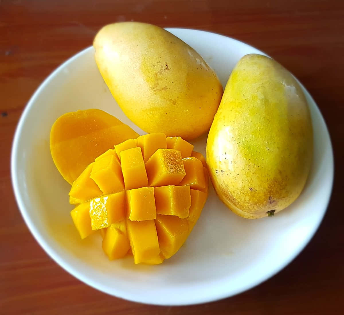 A White Plate With Mangoes