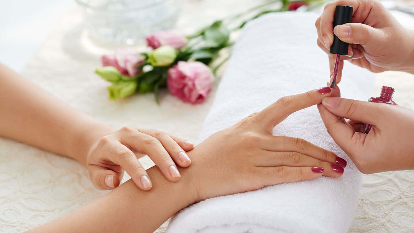 A Woman Getting Her Nails Done At A Spa