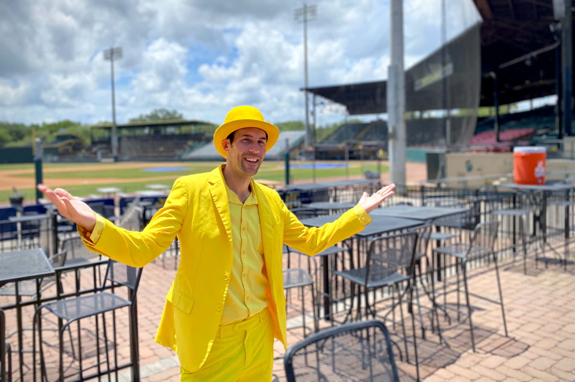 Manin Yellow Suitat Baseball Stadium Wallpaper