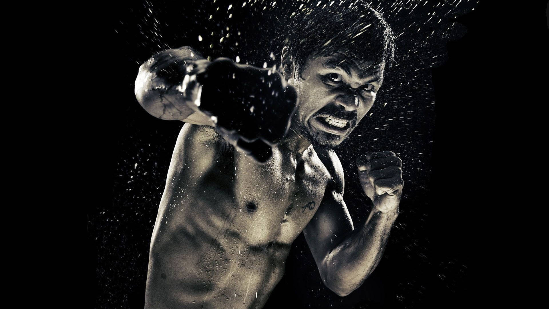 Manny Pacquiao Power Punch Tapet: Se verdens berømte bokser bruge kraft i hvert slag. Wallpaper