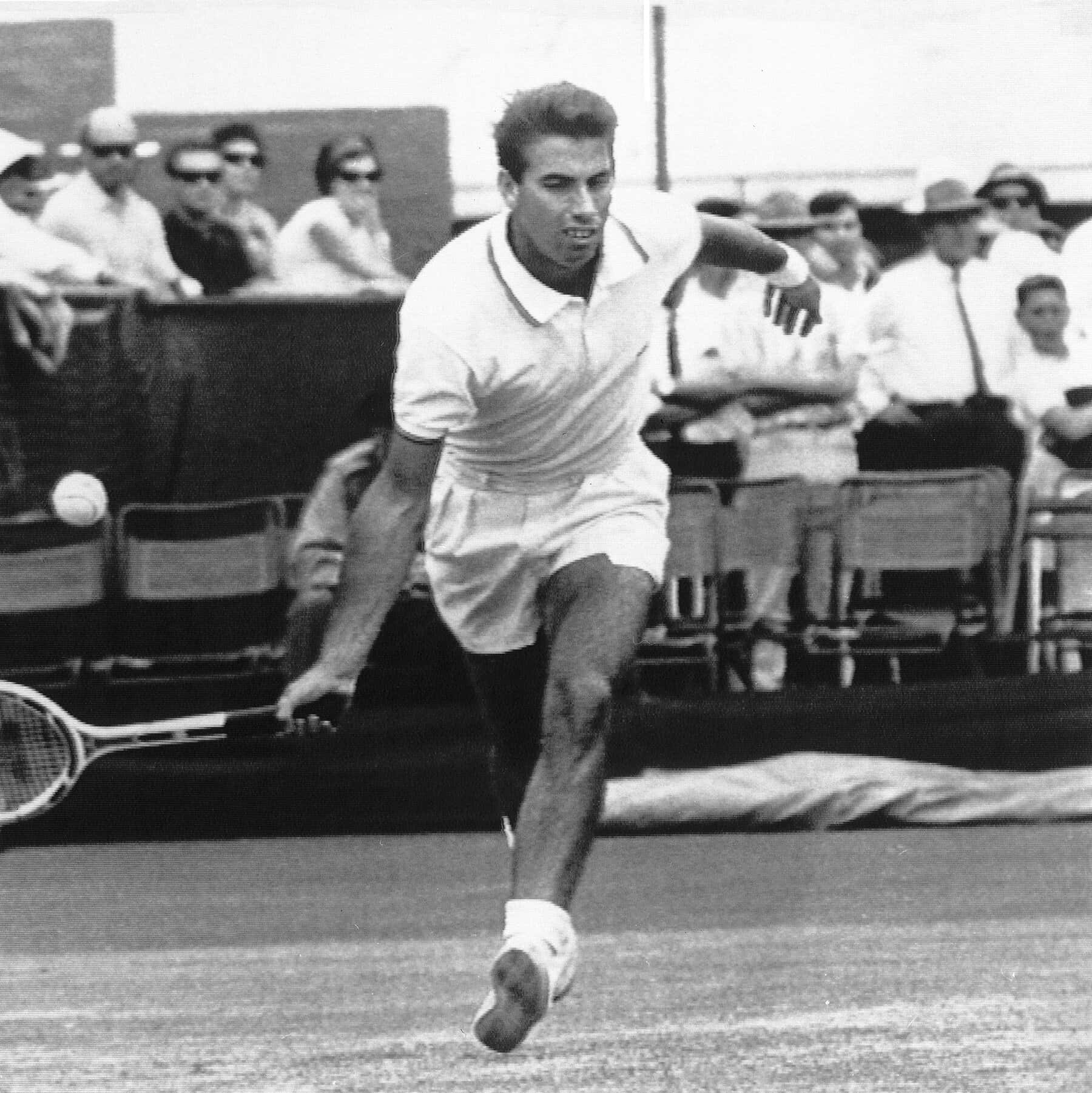 Manuel Santana Playing During A Tennis Tournament Wallpaper