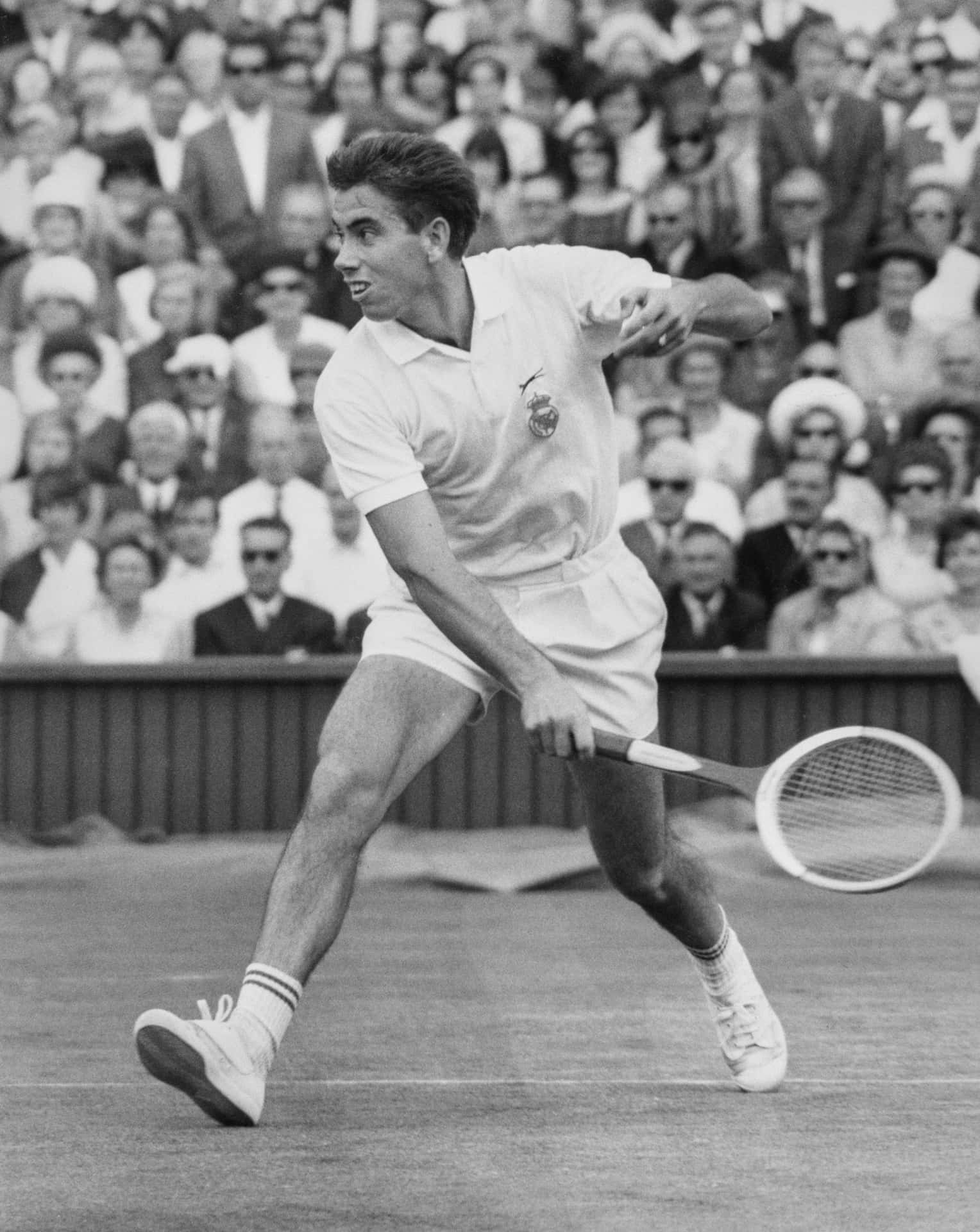 Manuel Santana Playing In Tennis Court Wallpaper