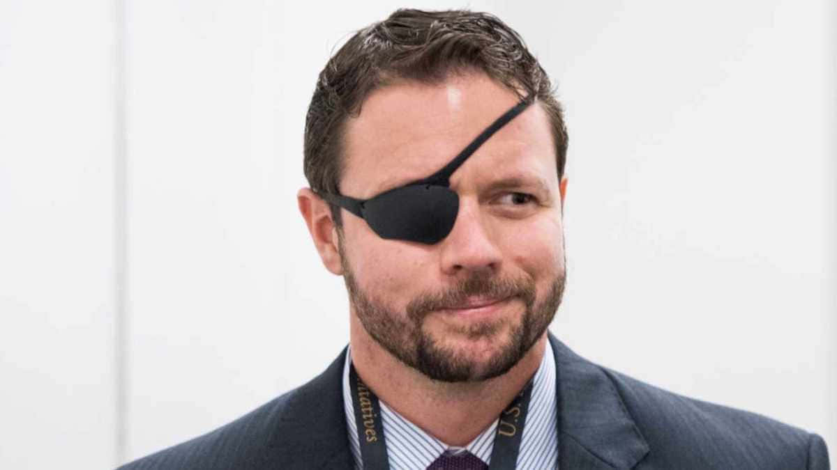 Manwith Eyepatch Suitand Tie Wallpaper