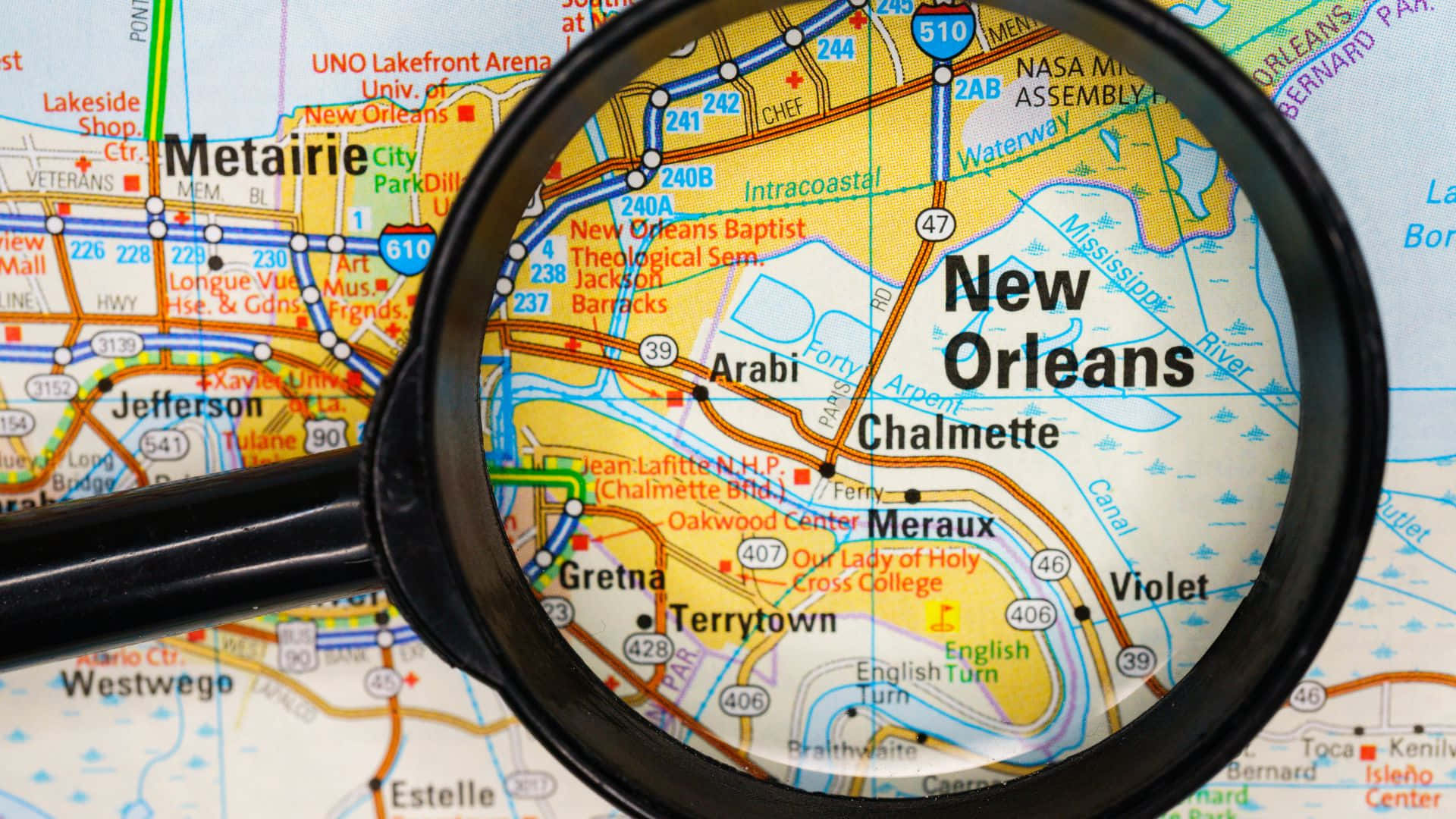 Magnifying Glass Focusing New Orleans Map Background