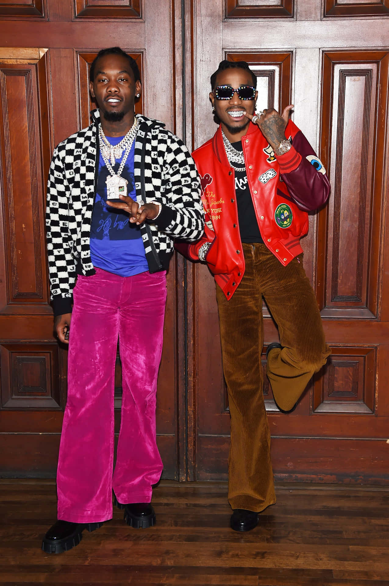 Two Men In Colorful Pants Standing Next To Each Other