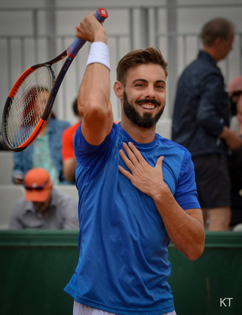 Marcel Granollers Holding His Chest And Racket Wallpaper