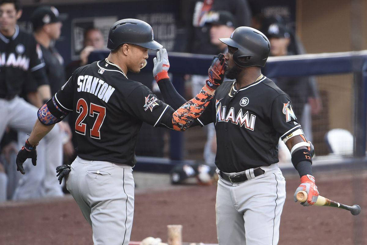 Marcell Ozuna Tapping Shoulders With Stanton Wallpaper