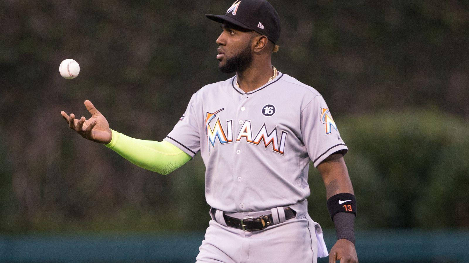 Download Marcell Ozuna With Ball In Air Wallpaper