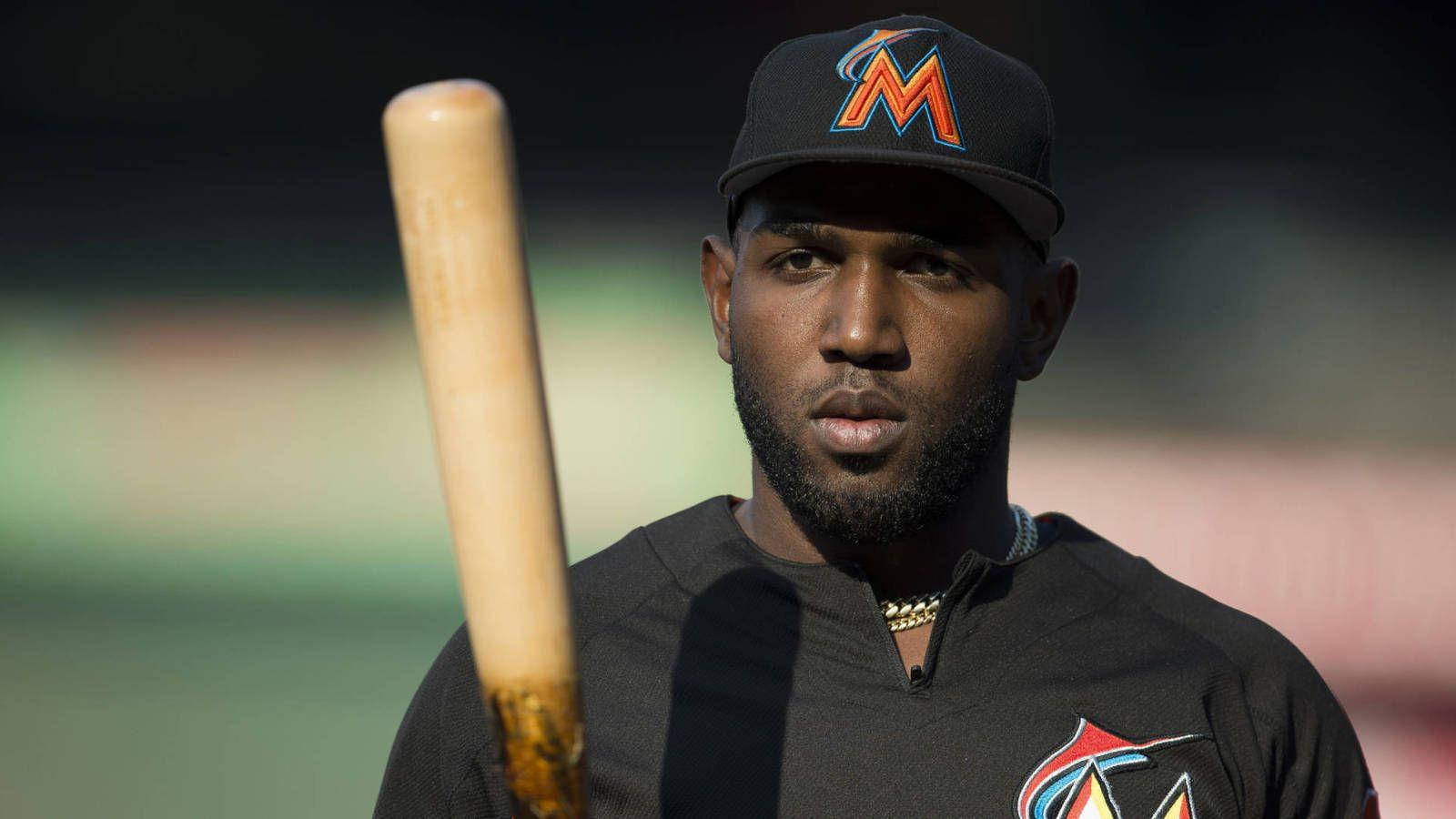 Marcell Ozuna With Baseball Bat In Front Wallpaper