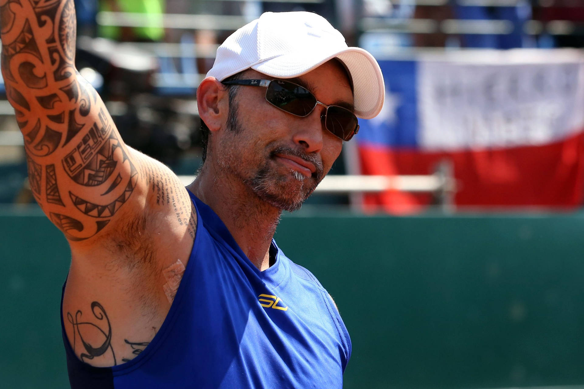 Former World No.1 Tennis Player Marcelo Ríos Flaunting Sunglasses Wallpaper
