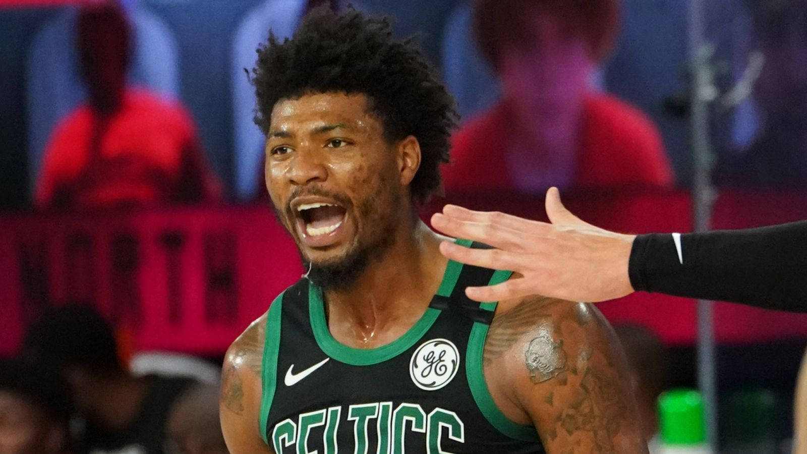 Marcussmart Skriker Ut För Seger. (context: This Could Be A Possible Caption For A Basketball-themed Wallpaper Featuring Marcus Smart.) Wallpaper