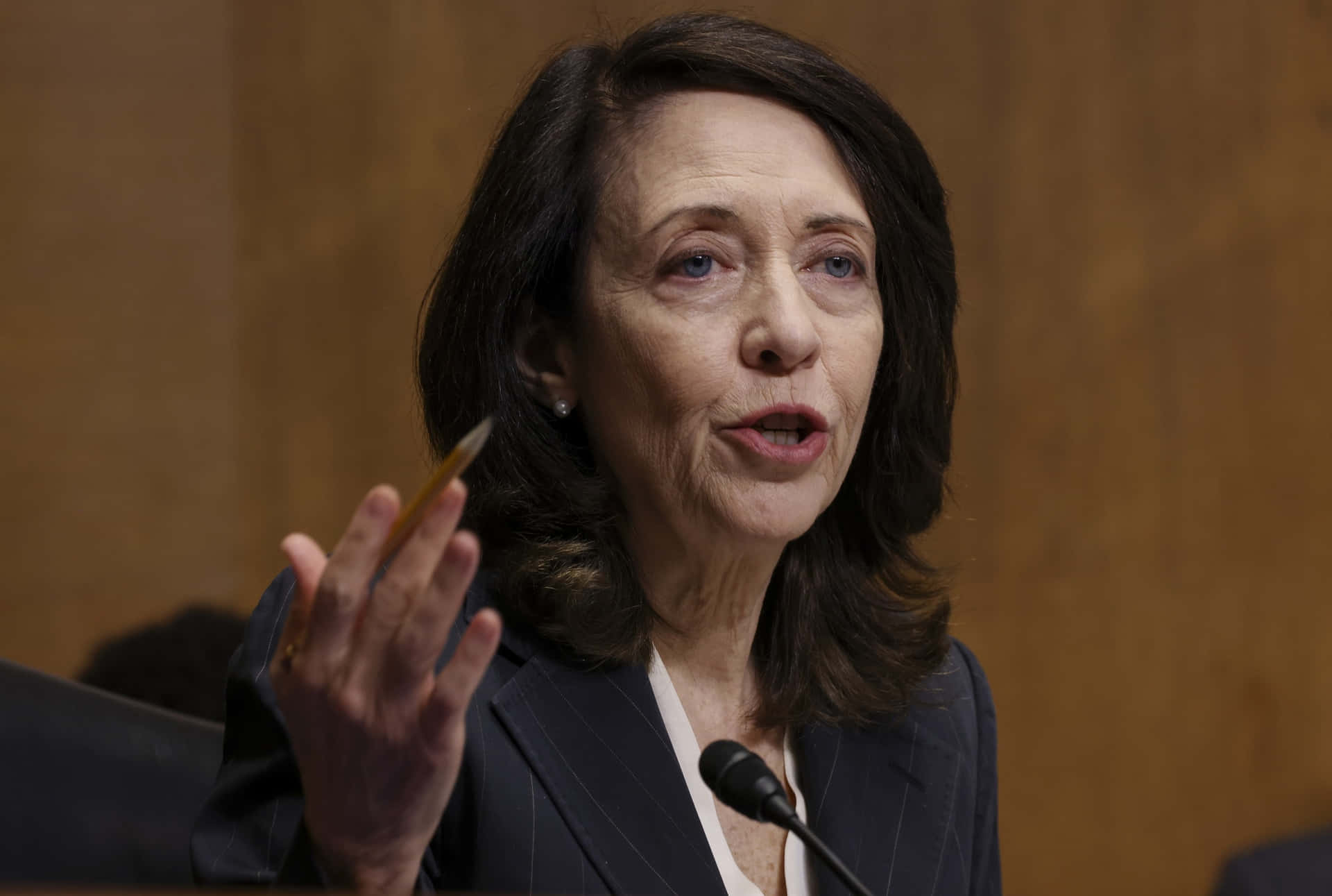 Maria Cantwell On Blurry Brown Background Wallpaper