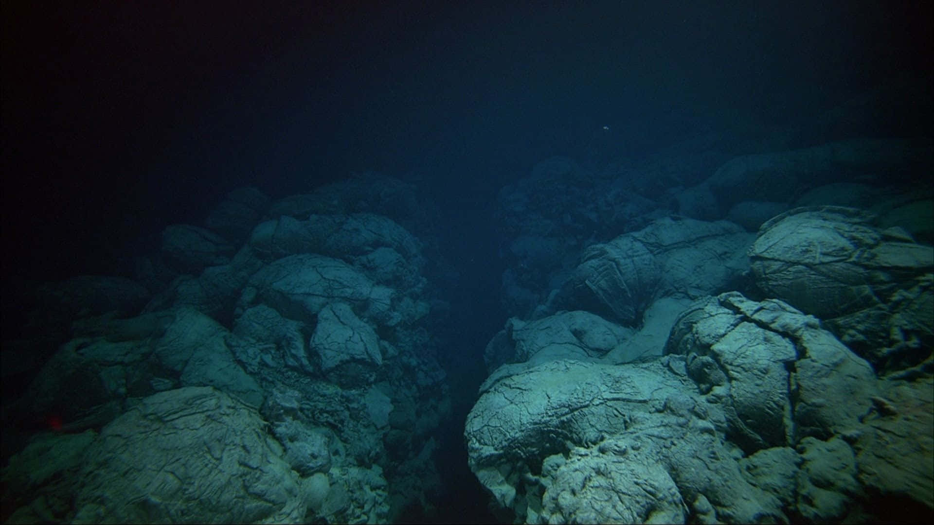 A View Of A Large Rock Formation In The Ocean