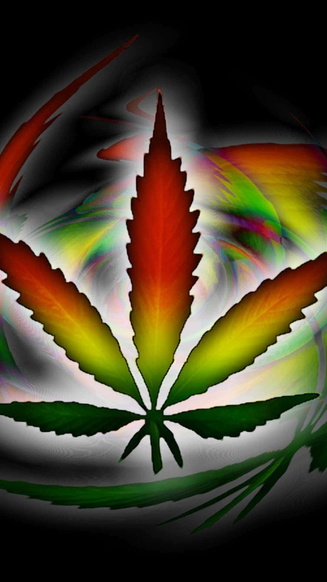 Marijuana Leaf In Rastafarian Colors Wallpaper