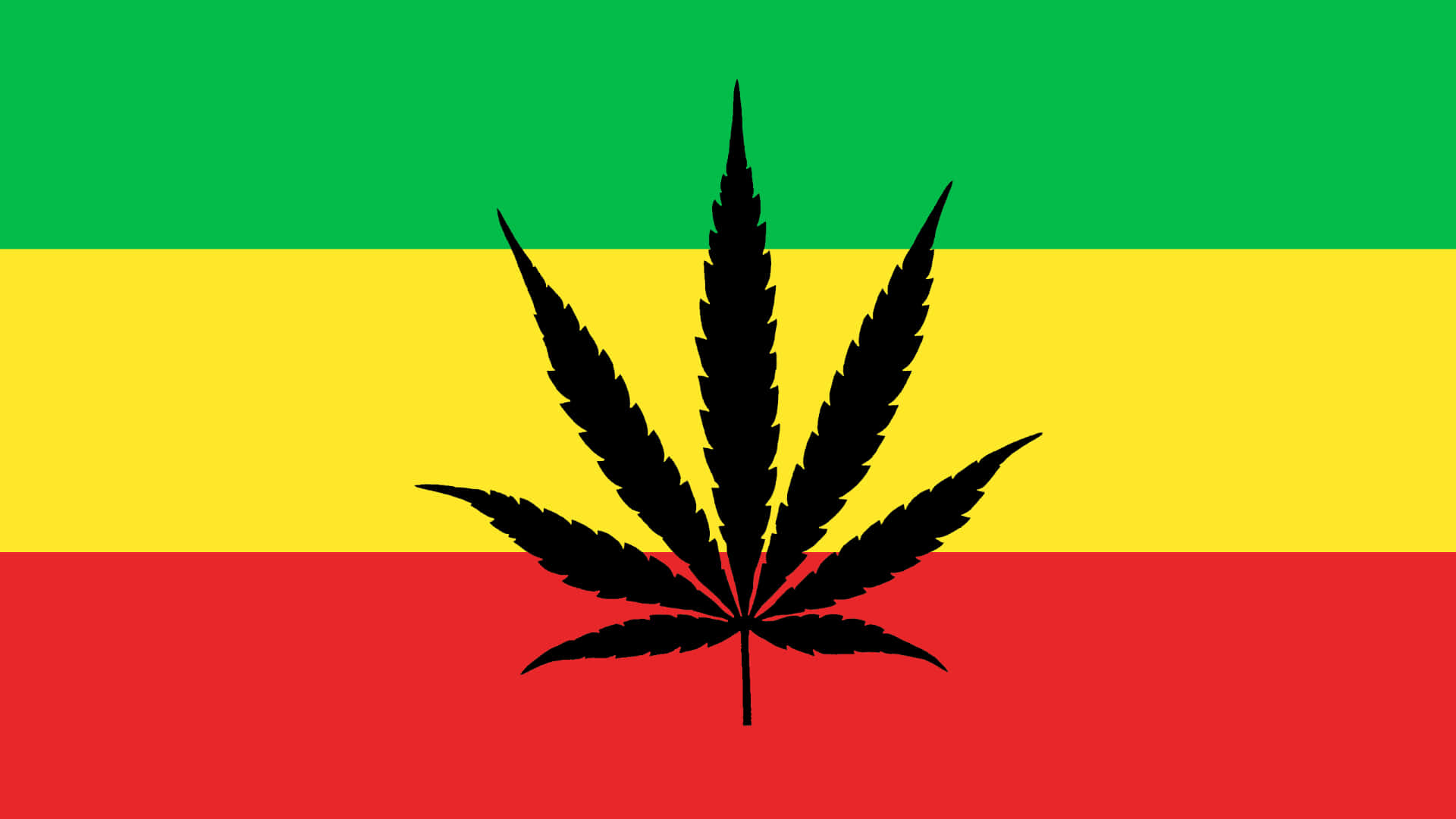 Marihuanablatt Auf Der Rasta-flagge Wallpaper