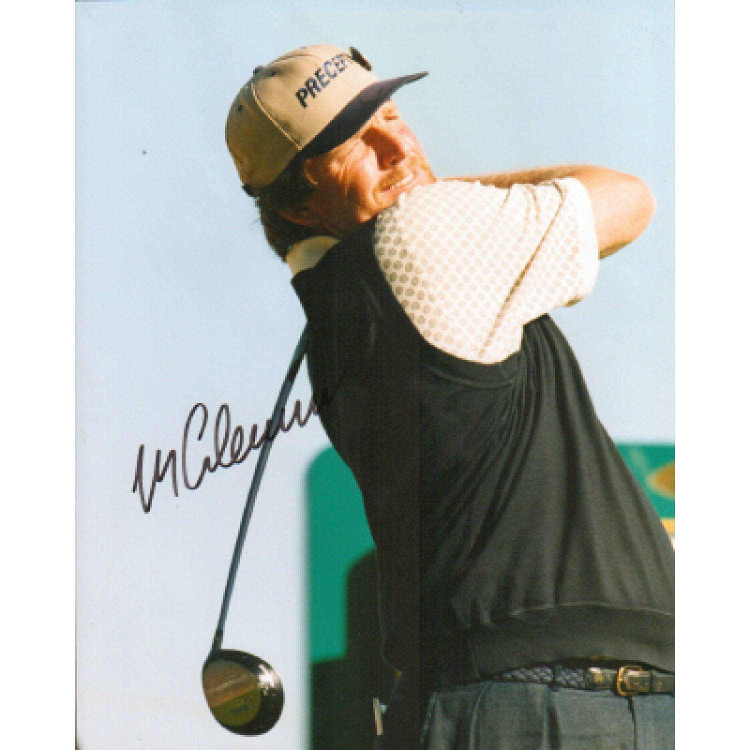 Professional golfer Mark Calcavecchia in a sunlit shot, looking focused in a brown cap. Wallpaper