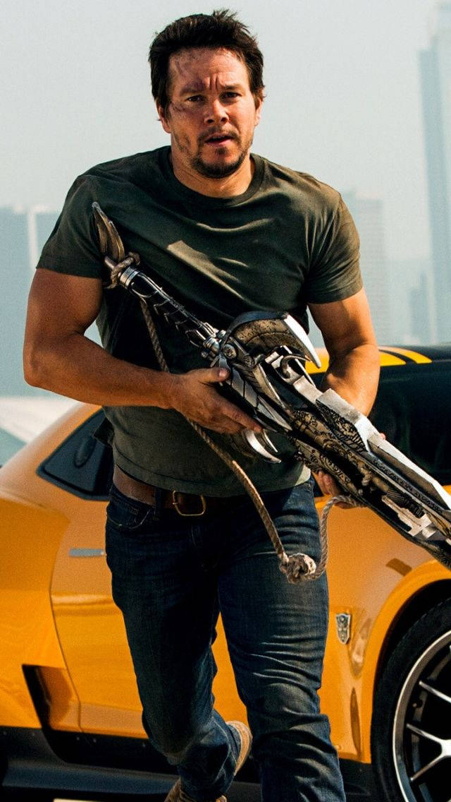 Mark Wahlberg Holding A Weapon Wallpaper