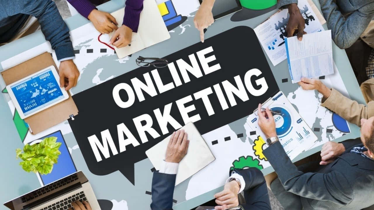 Online Marketing - A Group Of People Working Together Wallpaper