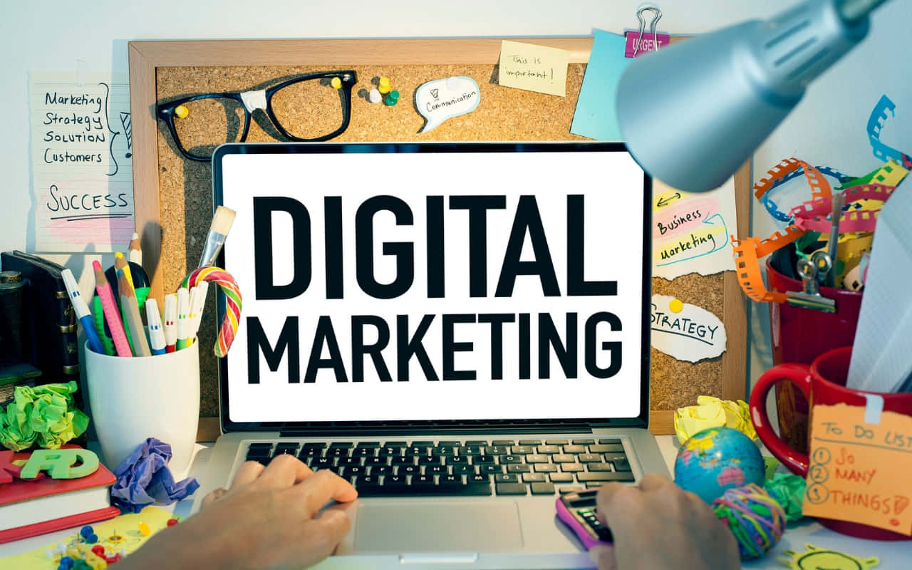 Digital Marketing - A Person Working On A Laptop Wallpaper