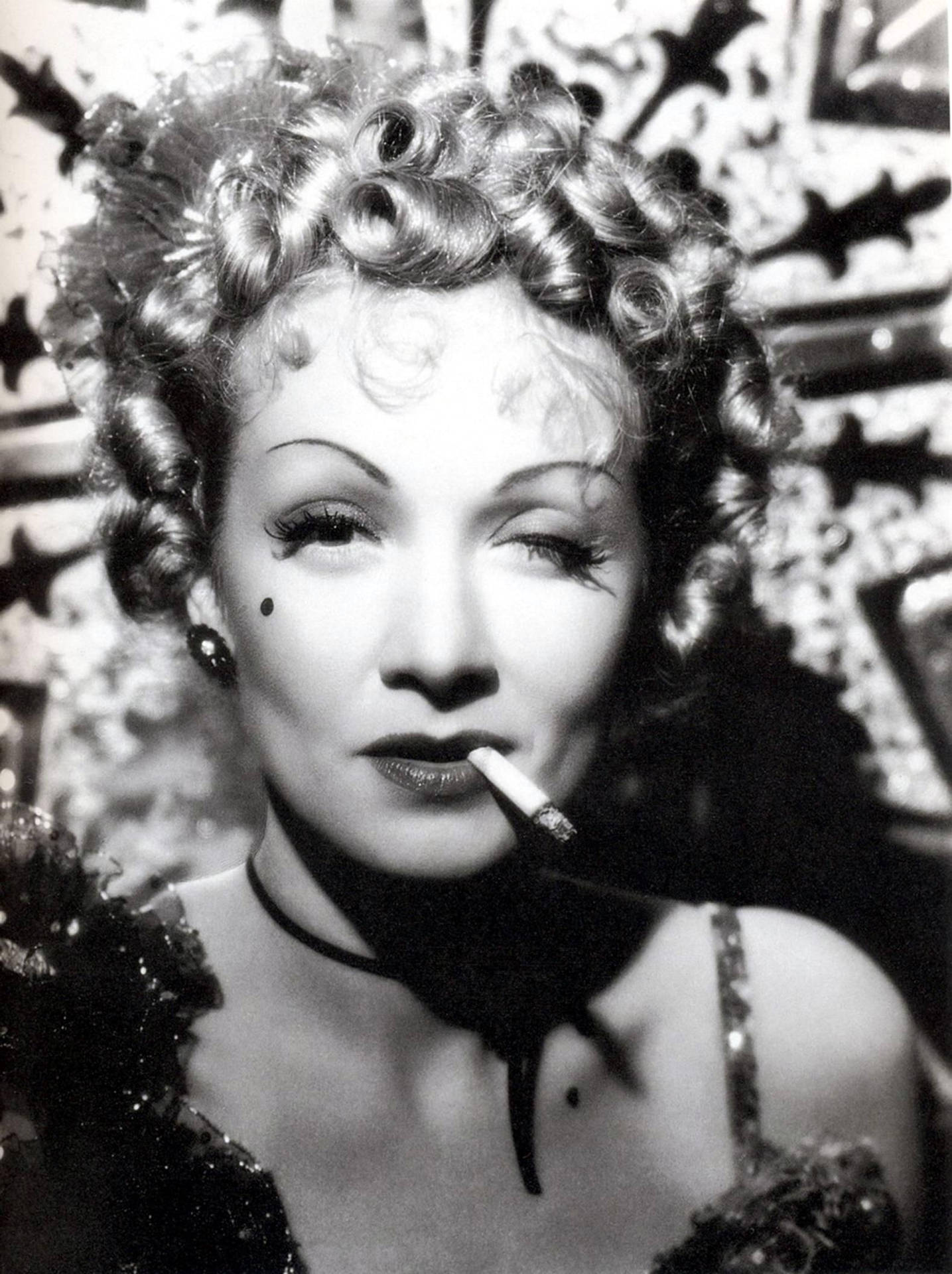Old Hollywood Glamour - Marlene Dietrich Winking while Smoking Wallpaper