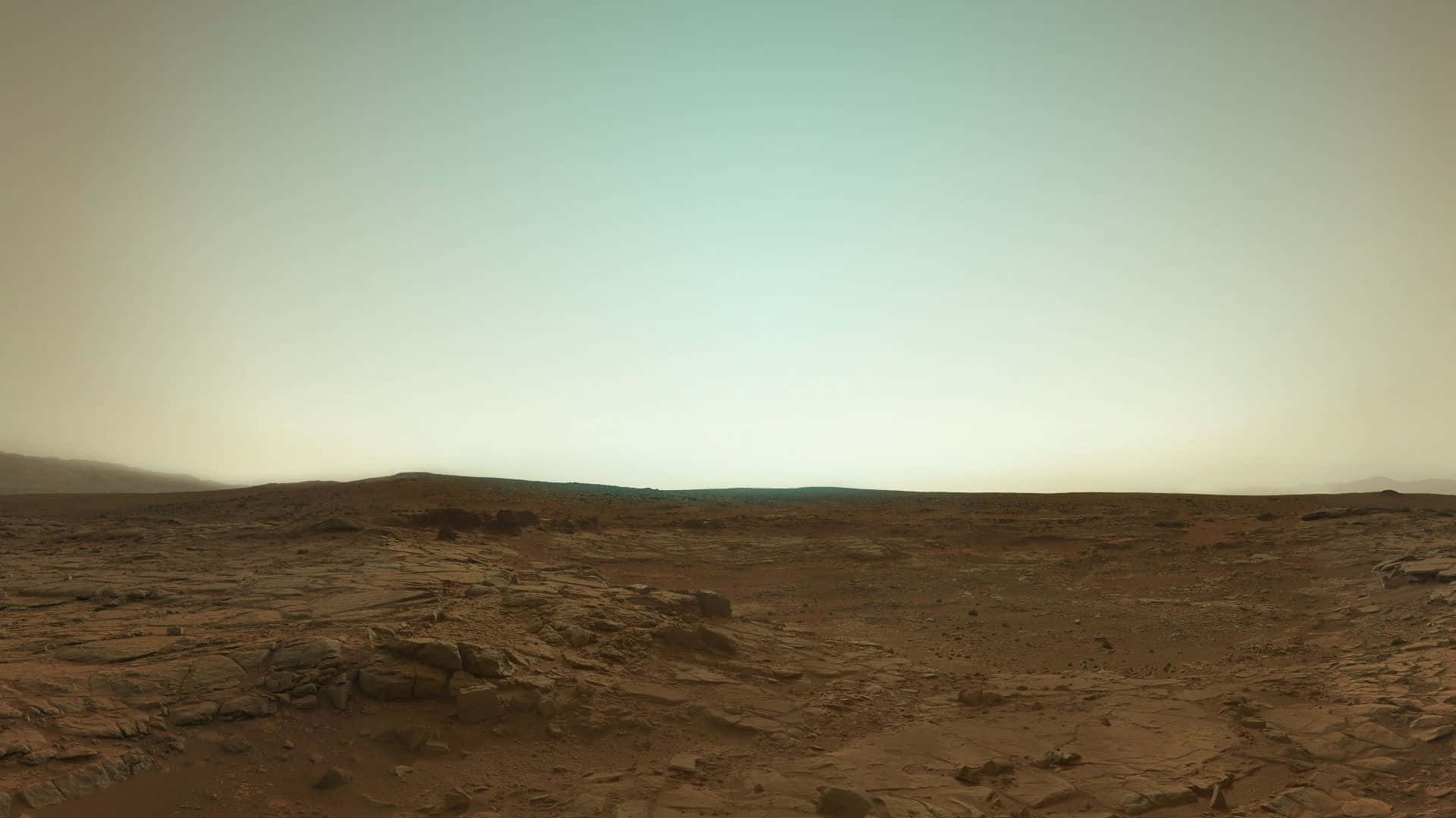 Breathtaking Mars Landscape with Rocky Terrain and Orange Sky Wallpaper