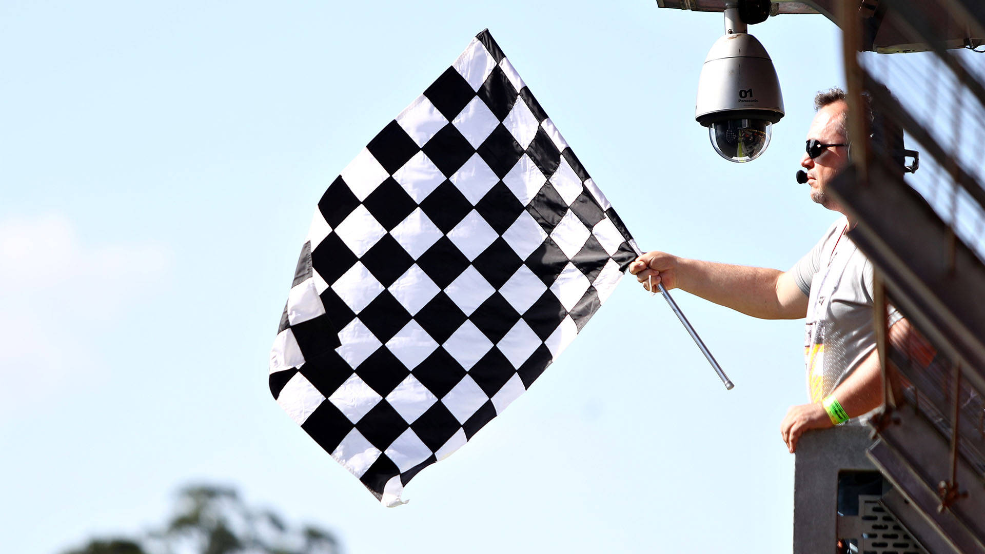 Marshal Holding A Checkered Flag Wallpaper